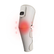 Thiết bị massage chân màu trắng, có đèn đỏ phát sáng và các biểu tượng sóng rung.