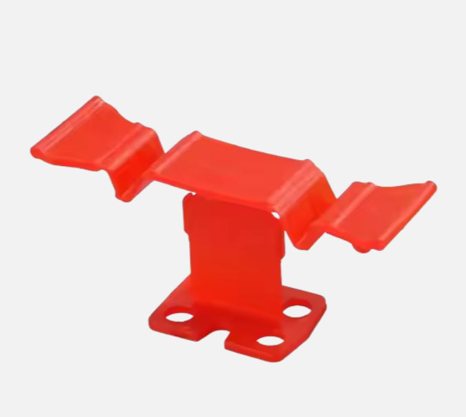 Plastic tile leveling system includes clamps and wedges 