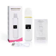 Máy chà da màu trắng, màn hình đen, hộp đựng, dây sạc USB, và hướng dẫn sử dụng.