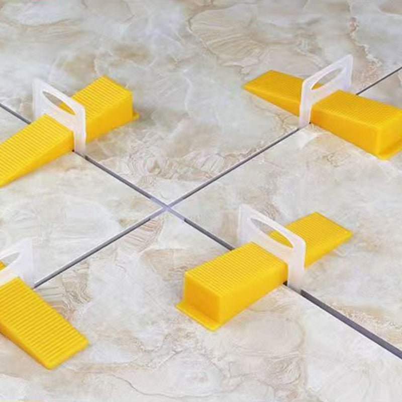 Ceramic floor tile leveling system with wedges 