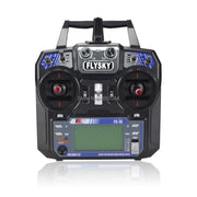 Điều khiển từ xa màu đen Flysky FS-i6, màn hình LCD xanh, nút điều chỉnh và cần gạt đỏ.