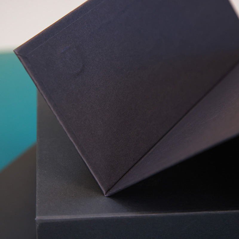 Black Kraft cardboard gift box with glossy lamination, eco-friendly packaging, for food, perfume, watches, jewelry, made from recycled corrugated paper. 