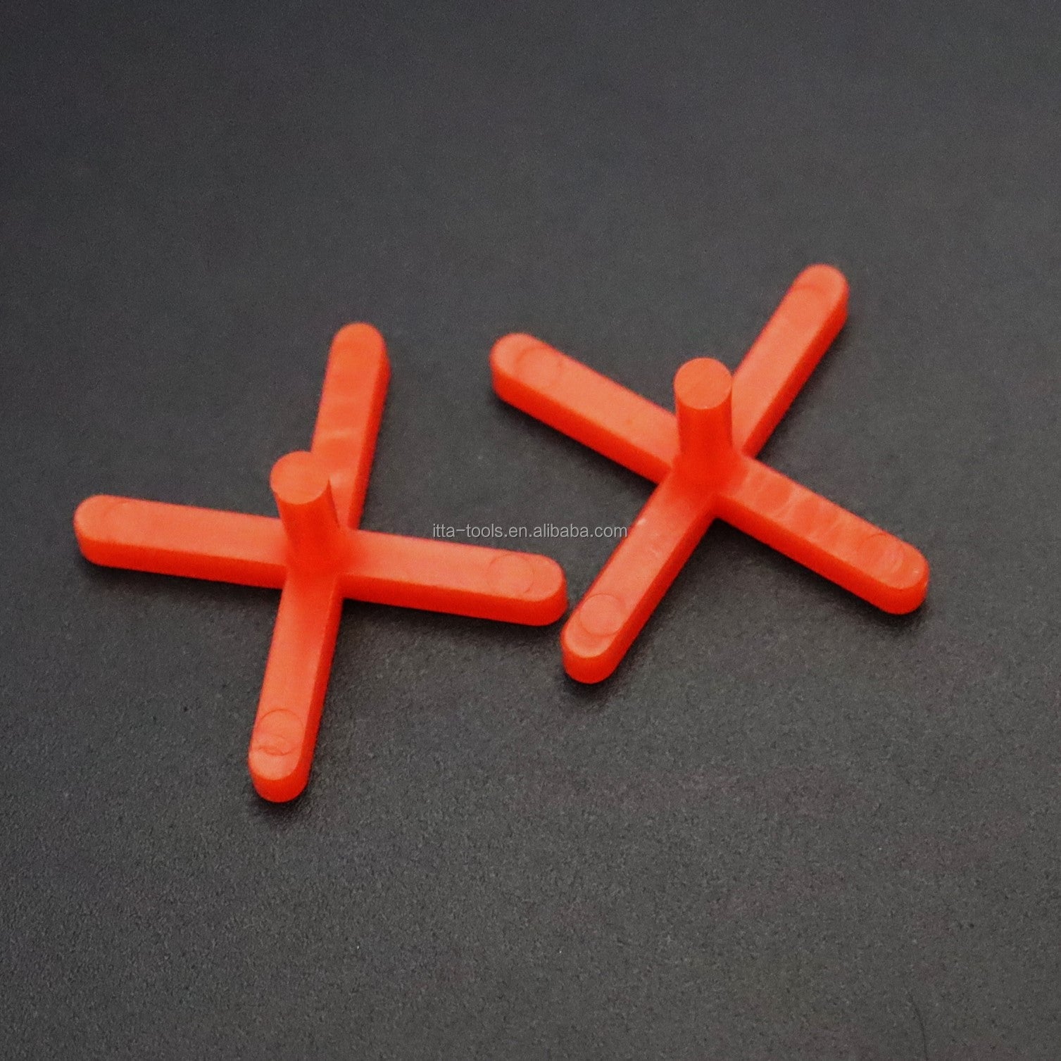 Orange cross shaped plastic tile leveling wedge system 