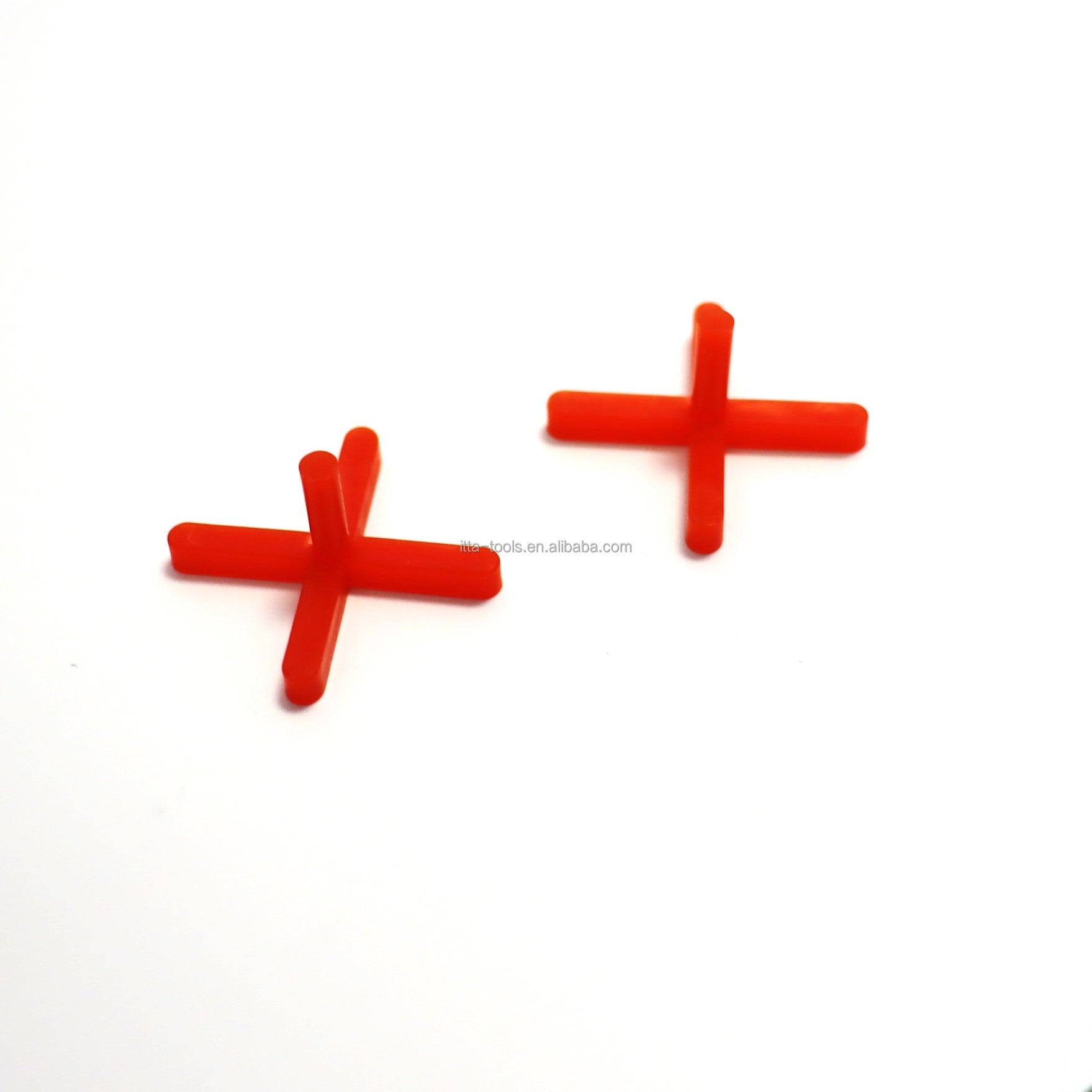 Orange cross shaped plastic tile leveling wedge system 