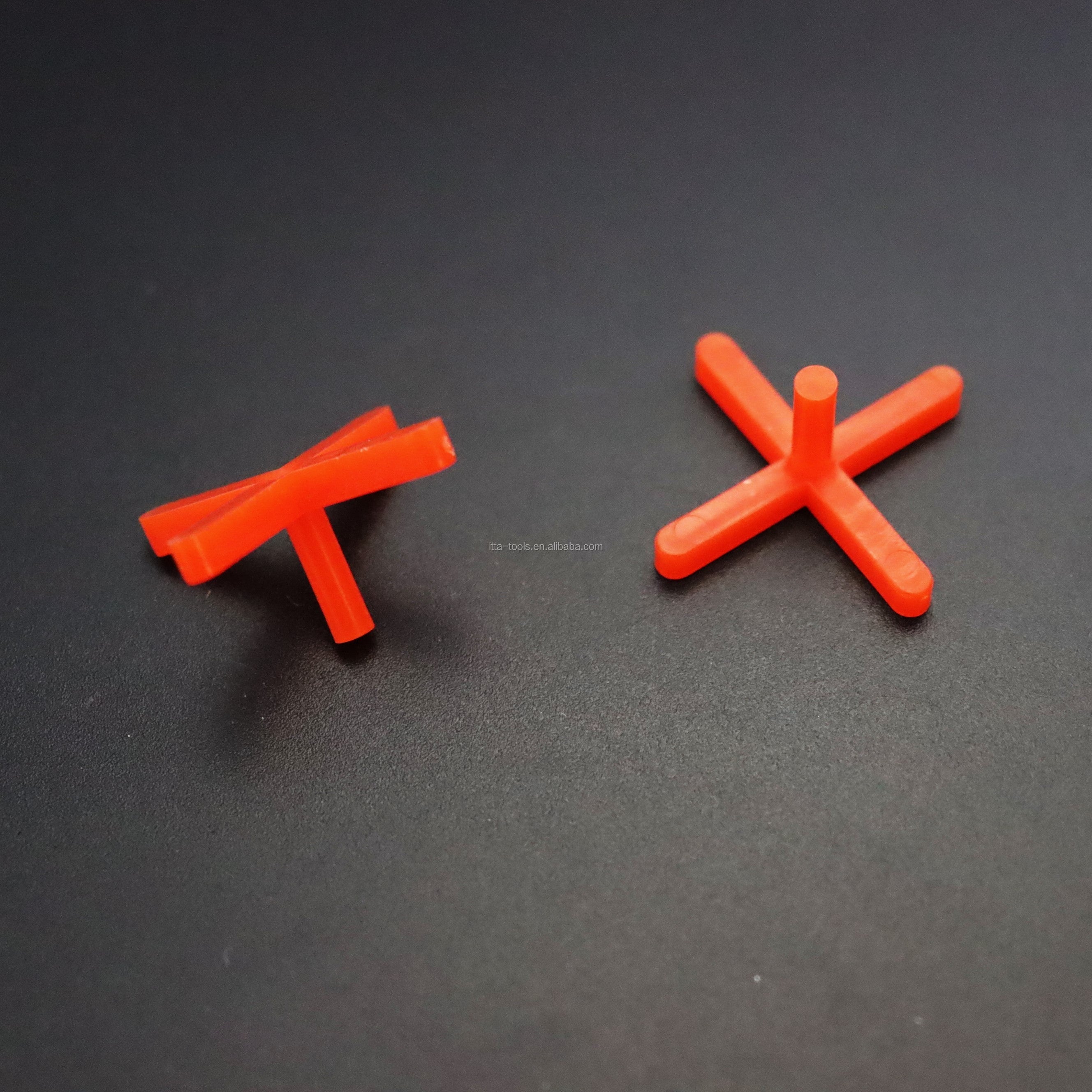 Orange cross shaped plastic tile leveling wedge system 