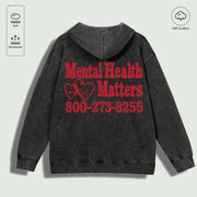 Áo hoodie đen mặt sau, chữ đỏ "Mental Health Matters" và số điện thoại, chất liệu 100% cotton.