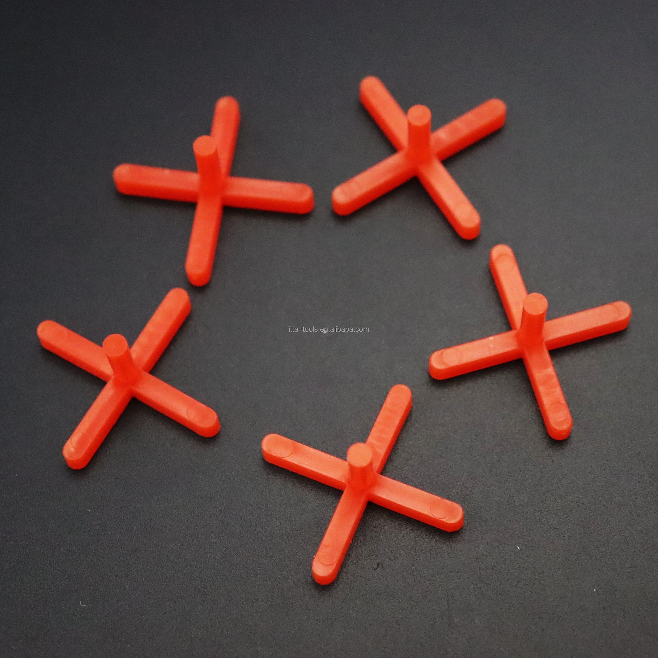 Orange cross shaped plastic tile leveling wedge system 