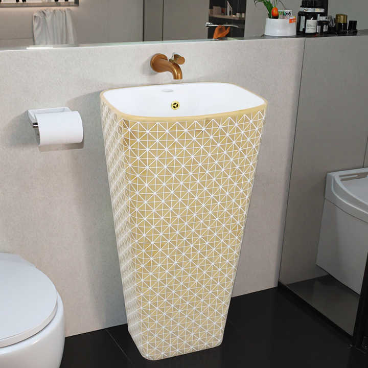 Luxury gold-plated high-grade ceramic washbasin mounted on the bathroom floor for home and hotel 