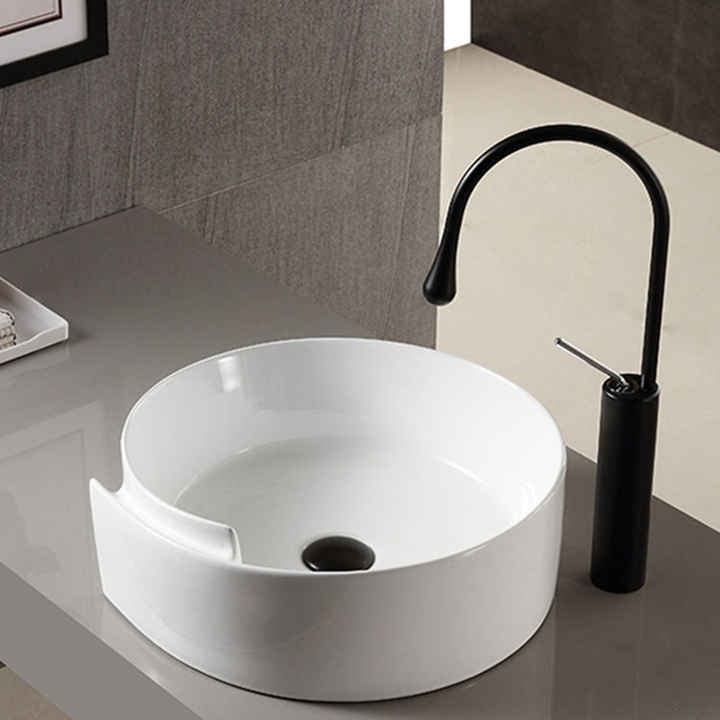 Ceramic splash-proof sink on bathroom countertop 