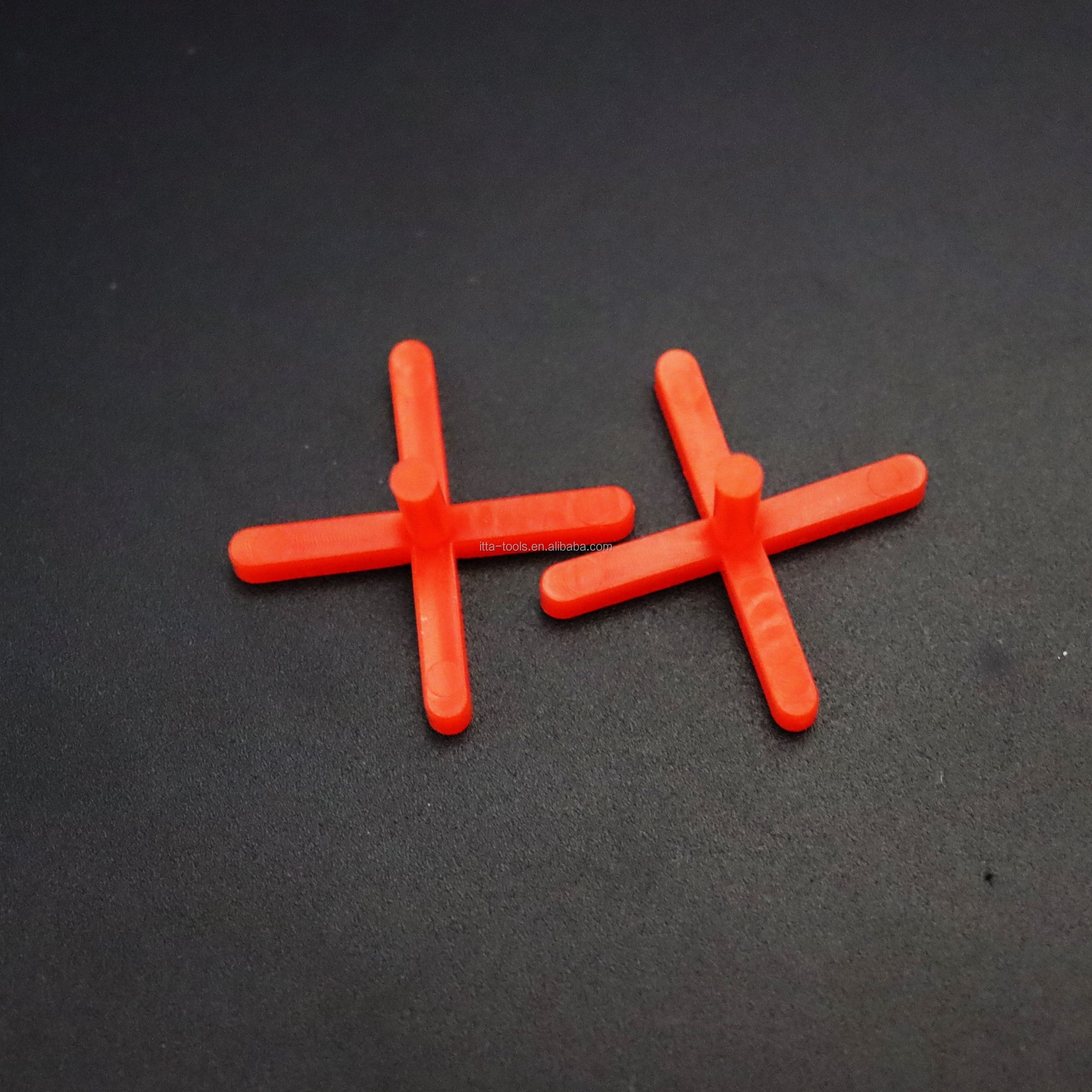 Orange cross shaped plastic tile leveling wedge system 