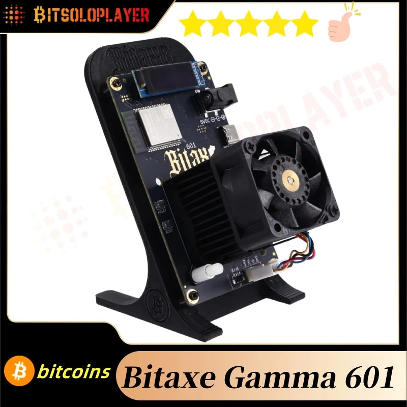 Thiết bị Bitaxe Gamma 601 trên giá đỡ, có quạt tản nhiệt và màn hình nhỏ.