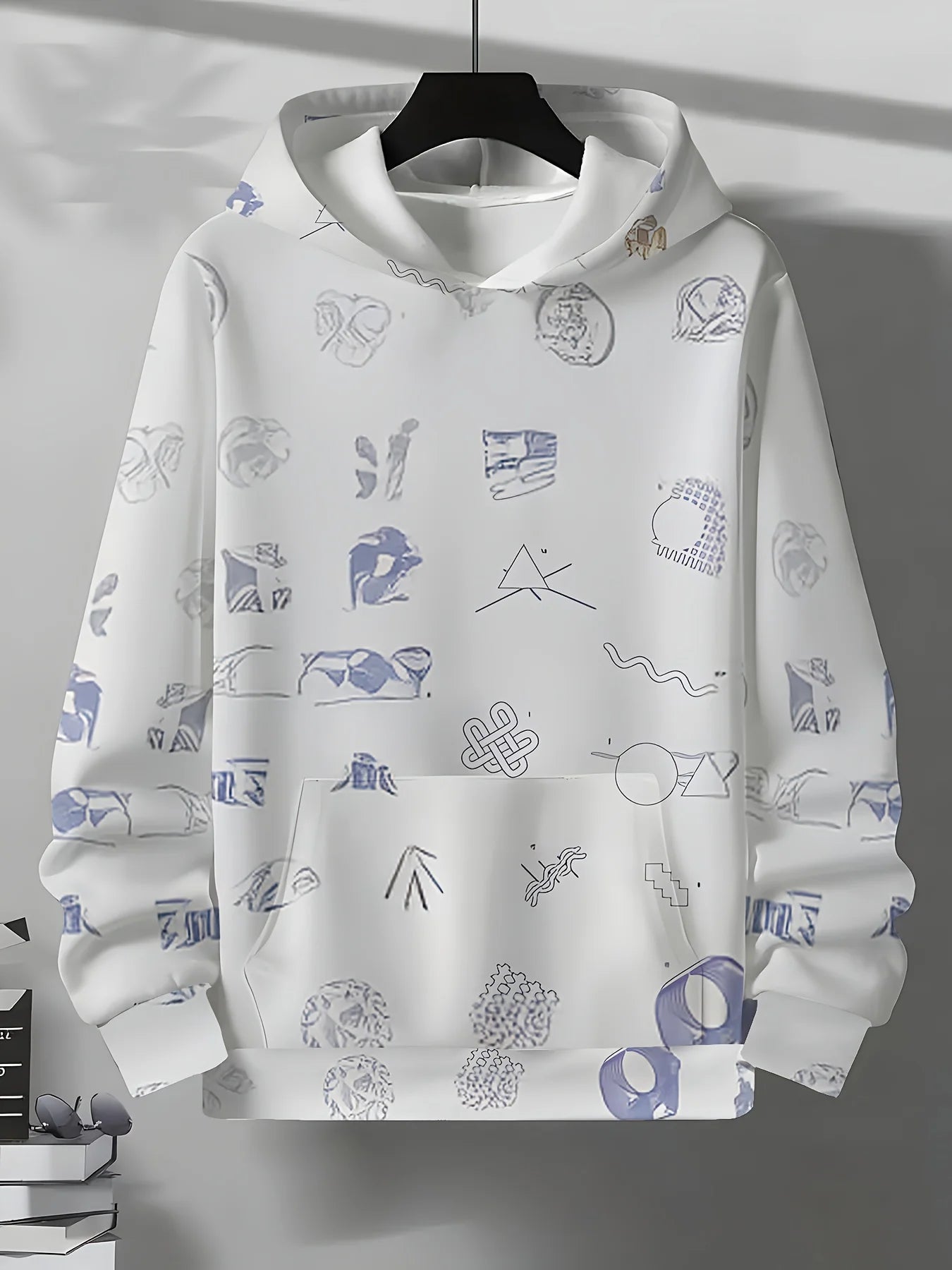 Áo hoodie trắng có họa tiết xanh lam và tím nhạt, với nhiều hình dạng trừu tượng nhỏ.