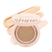 Phấn nước màu nude với nắp chữ "Shine" và vệt nền màu be phía sau.