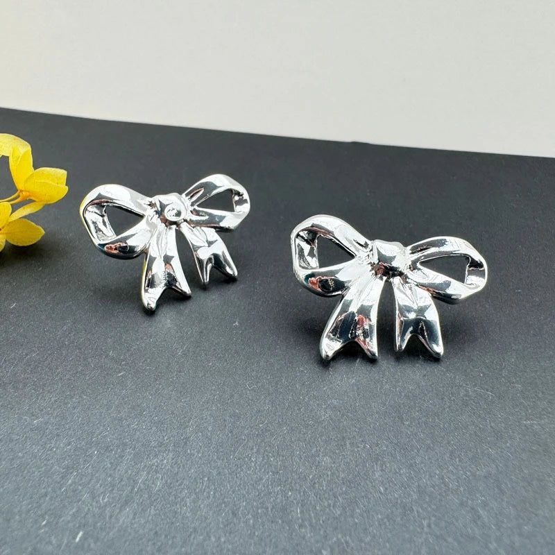 Shiny Silver Bow: Elegant Earrings For Women