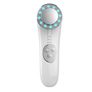Thiết bị làm đẹp trắng với đèn LED xanh, có màn hình tròn và ba nút điều khiển.