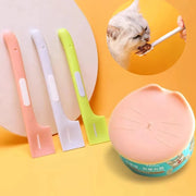 Ba dụng cụ xúc thức ăn màu hồng, trắng, xanh. Chó mèo ăn bằng thìa, nắp hộp có hình mèo.