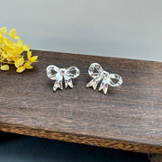 Shiny Silver Bow: Elegant Earrings For Women