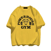 Áo phông vàng với logo "POWERHOUSE GYM" và hình người tập tạ màu đen.
