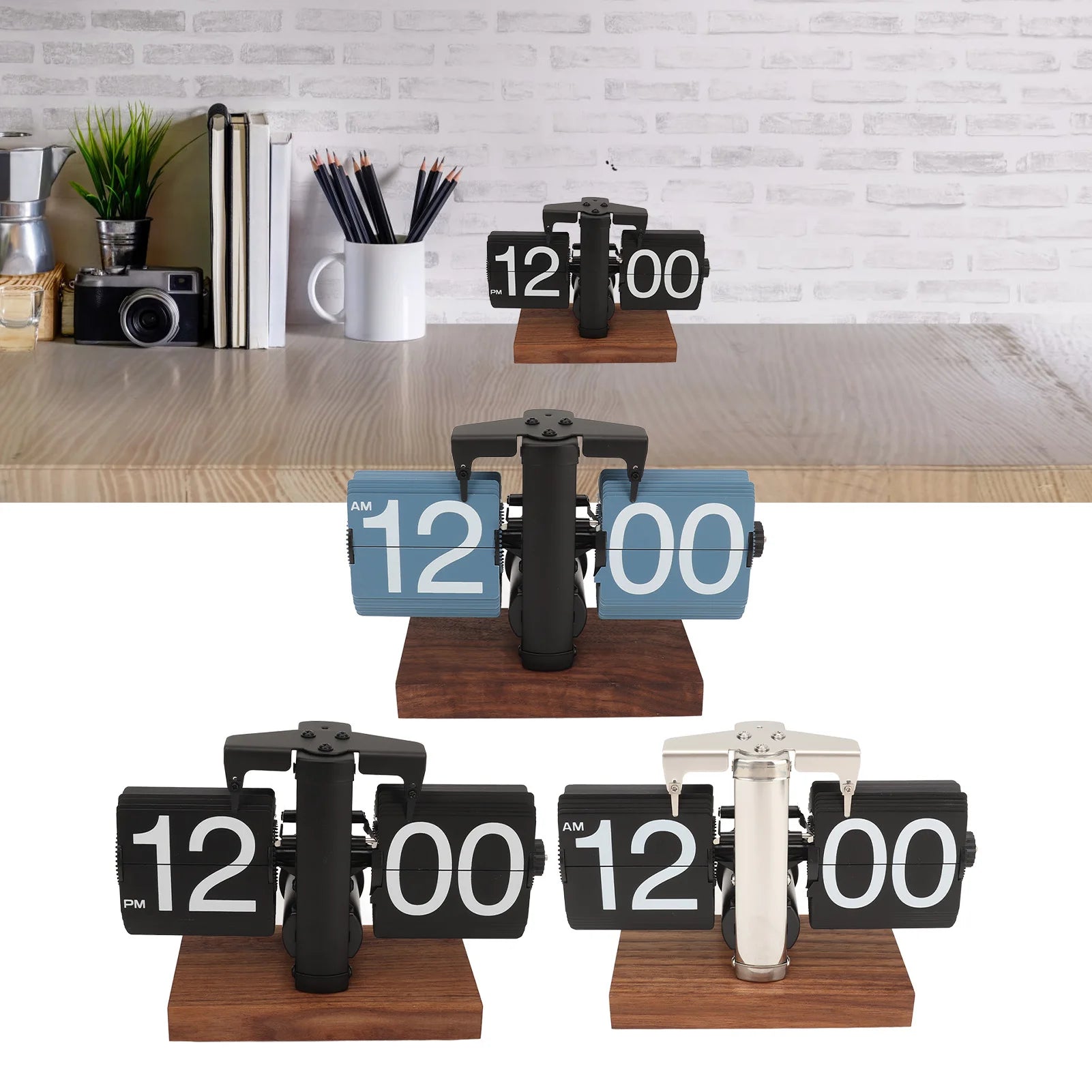 Bốn đồng hồ lật số trên đế gỗ, nền gạch trắng, có sách, máy ảnh và cốc bút.