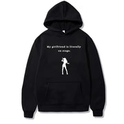 Áo hoodie màu đen, dòng chữ trắng "My girlfriend is literally on stage" và hình người màu trắng.