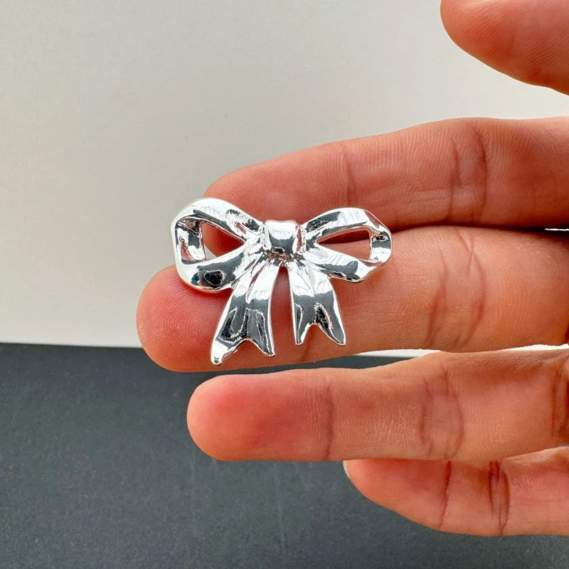 Shiny Silver Bow: Elegant Earrings For Women