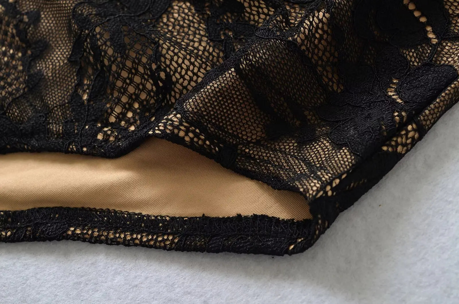 Fall 2025 color-blocked lace bodysuit, high neck, sleeveless, sexy