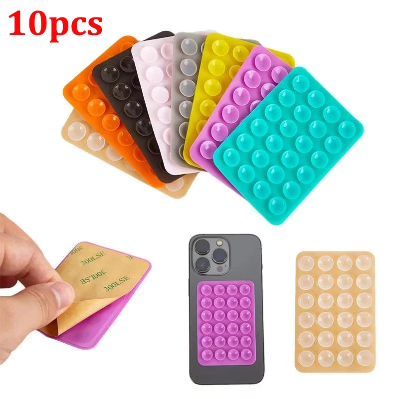 10 miếng đệm tròn đủ màu, dính vào điện thoại, có màu cam, đen, hồng, tím, xanh dương.