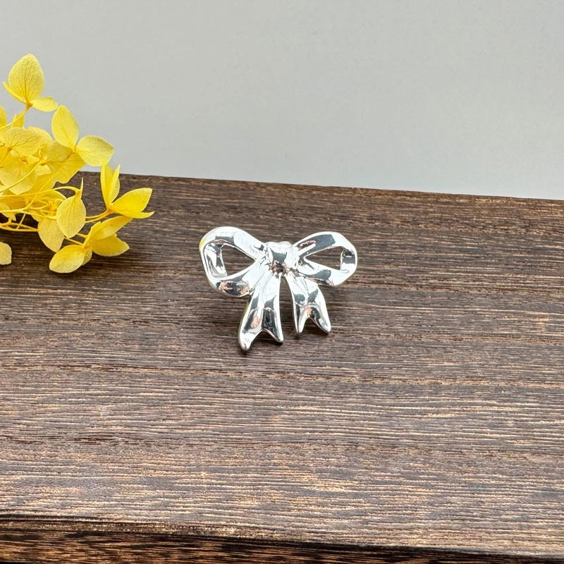 Shiny Silver Bow: Elegant Earrings For Women