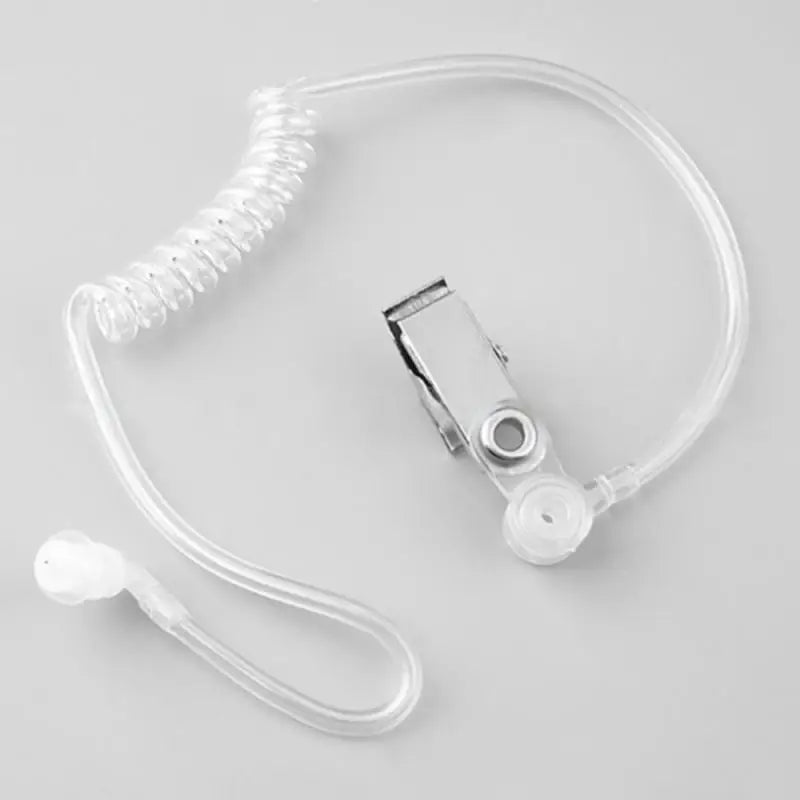 Ống tai nghe trong suốt với dây cuộn và kẹp kim loại trên nền xám.