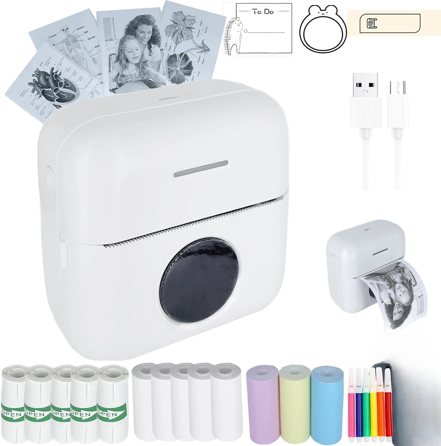 Máy in mini màu trắng, giấy in cuộn nhiều màu, cáp USB, bút màu, ảnh đen trắng in ra.