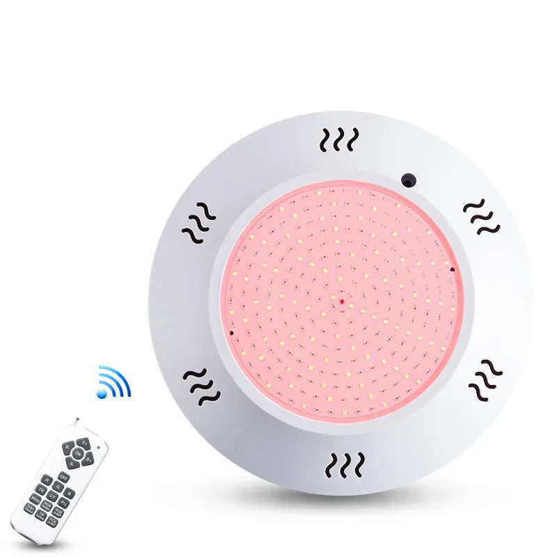 Đèn tròn LED hồng với điều khiển từ xa màu trắng.