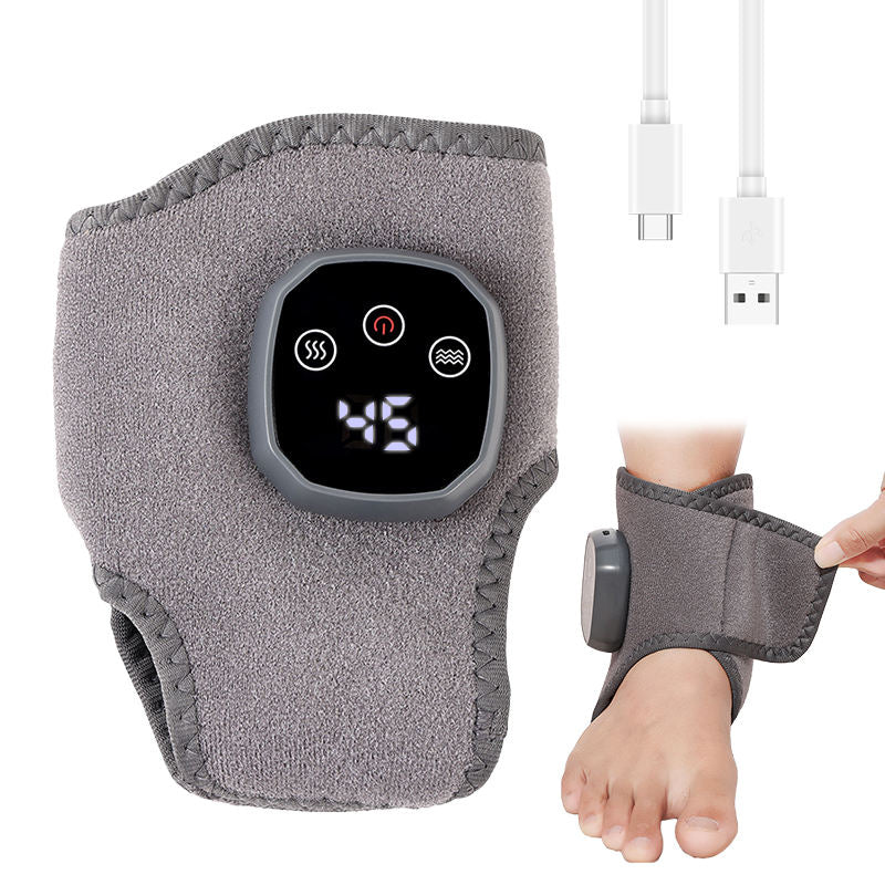 Băng điện xám có màn hình hiển thị số, kèm cáp USB, quấn quanh cổ chân.
