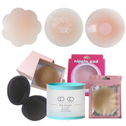 Các miếng dán ngực nhiều hình dáng, màu nude, với hộp đựng màu hồng và xanh ngọc.