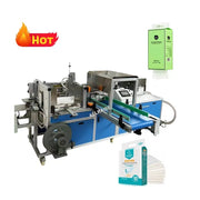 Máy đóng gói màu xanh dương, biểu tượng lửa đỏ "HOT", túi giấy xanh lá, hộp và khăn giấy trắng.