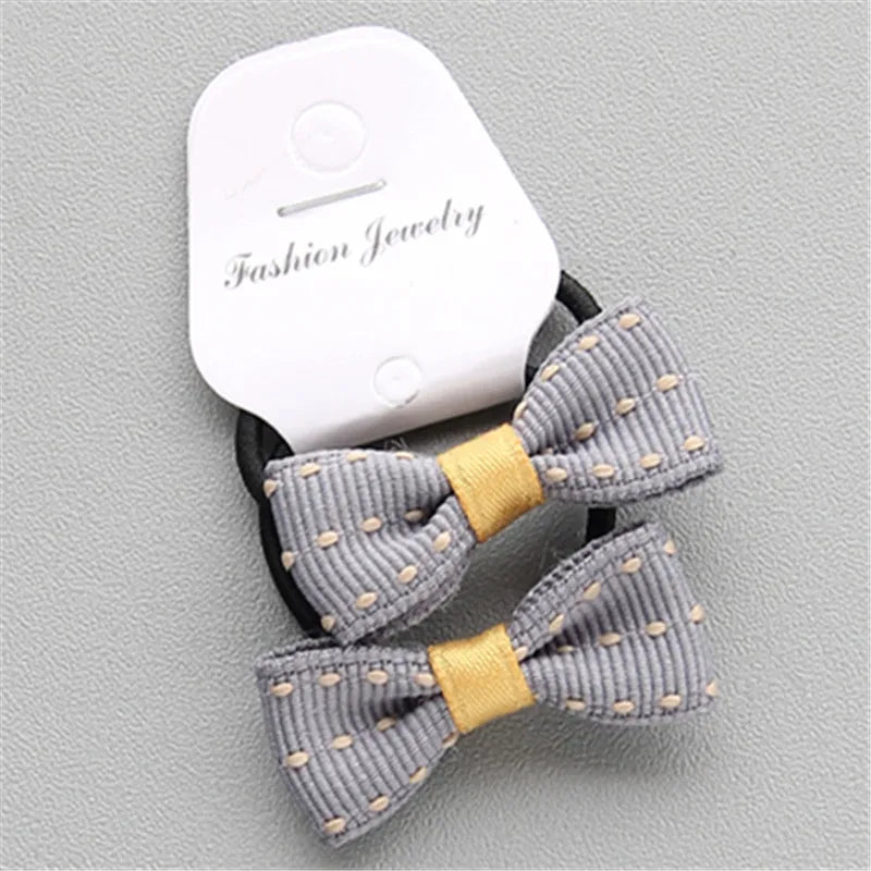 一組2個漂亮的蝴蝶結髮圈，適合女孩佩戴