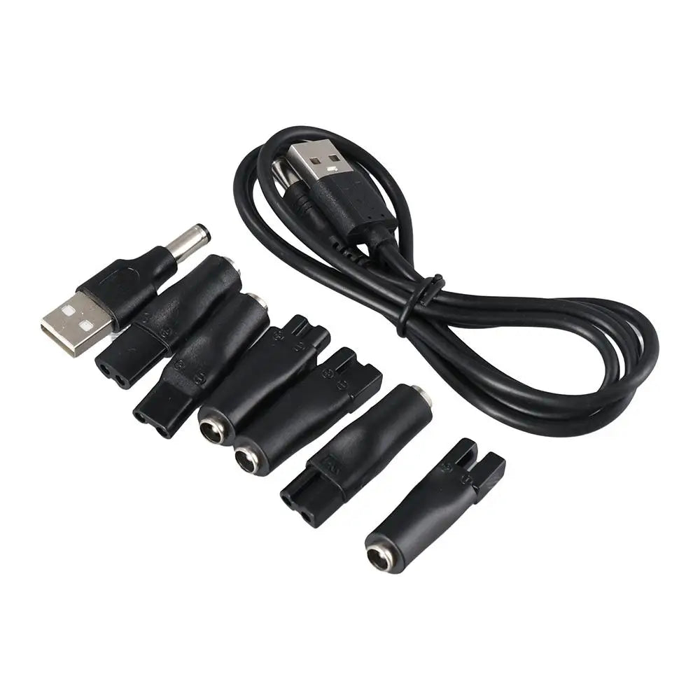Dây cáp USB màu đen và nhiều đầu cắm chuyển đổi nhỏ, màu đen, đặt trên nền trắng.
