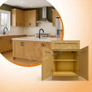 Tủ bếp gỗ màu sáng, thiết kế hiện đại, với tay cầm đen và mặt bếp trắng.