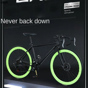 Xe đạp đen với vành sáng xanh lá, nền tối, dòng chữ "Never back down".