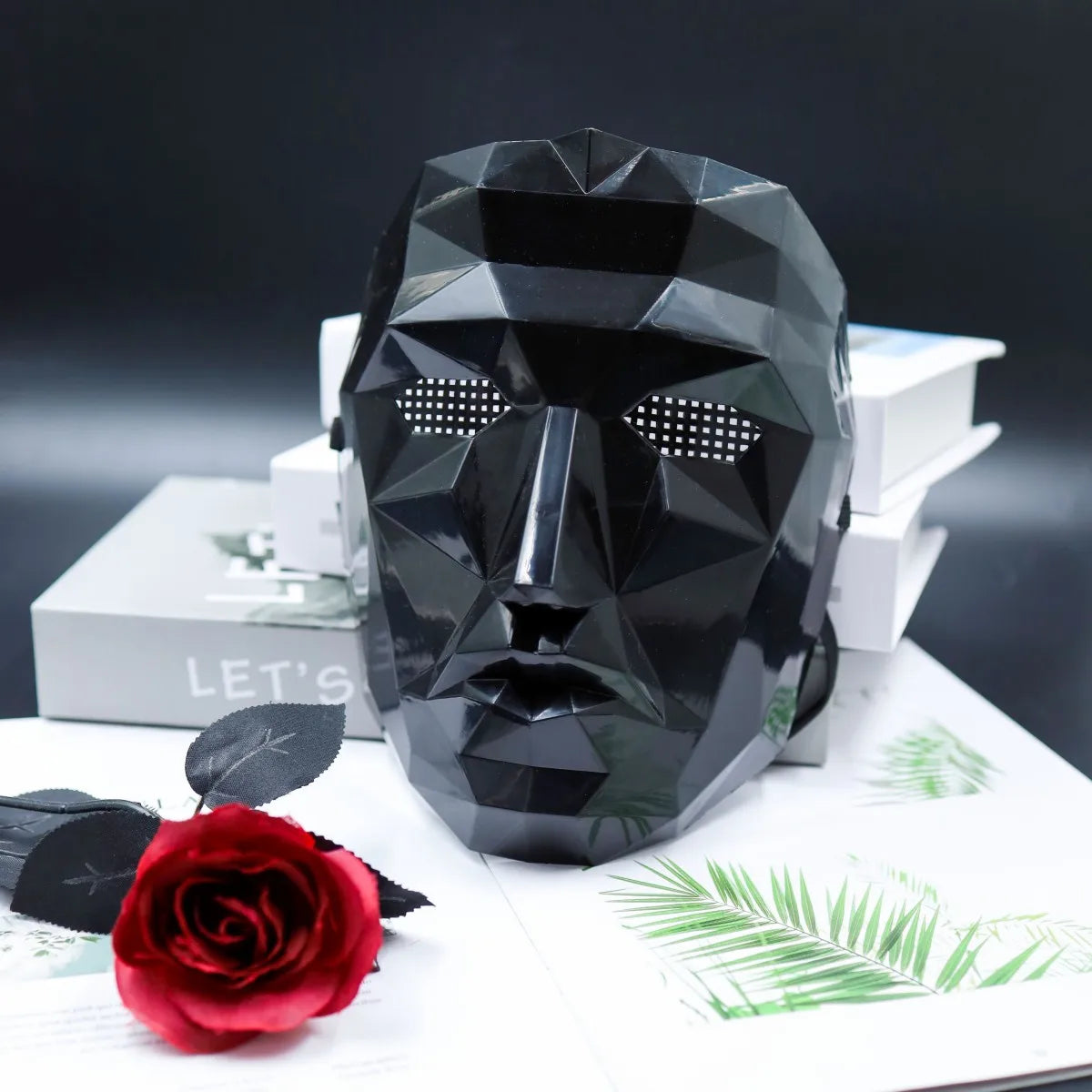 A black decorative mask, featuring a festive design, is ideal for cosplay parties, gala events, and decorative purposes. - Daisan Mart
