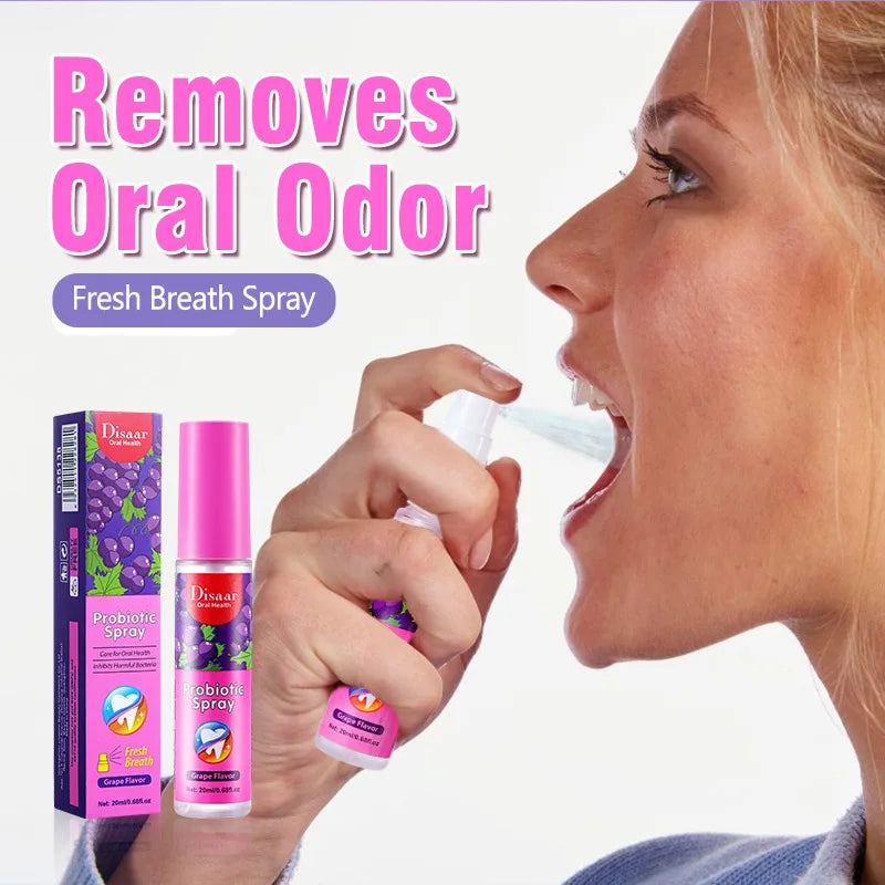 Người phụ nữ xịt chai màu hồng vào miệng, nền chữ "Removes Oral Odor" màu hồng.