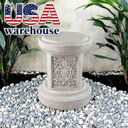 Bệ đá xám trang trí hoạ tiết hoa, xung quanh có sỏi trắng và cây xanh. Logo "USA warehouse" phía trên.