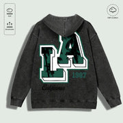 Áo hoodie xám đậm, chữ "LA" lớn màu xanh lá đậm, viền trắng, dòng chữ "California 1987".