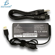 Bộ sạc laptop màu đen, có nhãn ELE-GATE, kèm dây nguồn quấn gọn, cổng kết nối vàng.