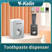 Máy lấy kem đánh răng Ousuwo màu xám và đen, nền cam, chữ "Toothpaste dispenser".