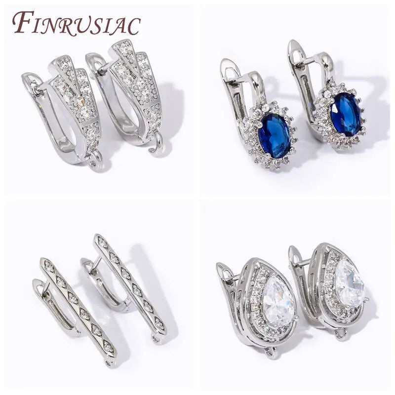 Bốn đôi bông tai bạc, đính đá xanh, trắng lấp lánh, kiểu dáng đa dạng trên nền trắng.