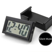 Đồng hồ kỹ thuật số màu đen hiển thị 12:40, có hộp đựng, chữ "Silent Mute" bên cạnh.