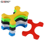 Các miếng đệm silicon hình chữ thập nhiều màu: vàng, xanh lá, đen, trắng, xanh dương, đỏ.